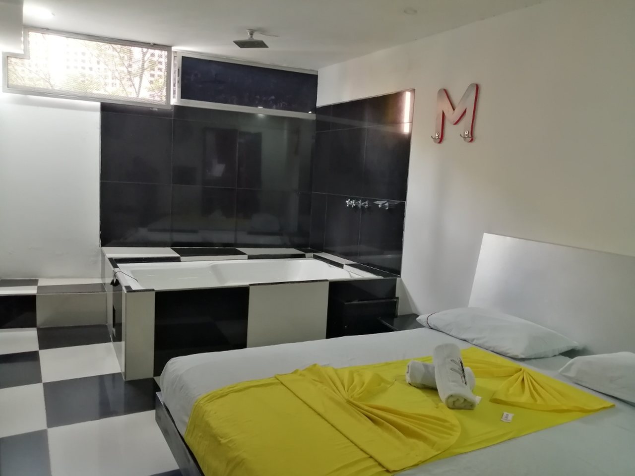 Habitación Bañera en Momentos Suite : MotelNow